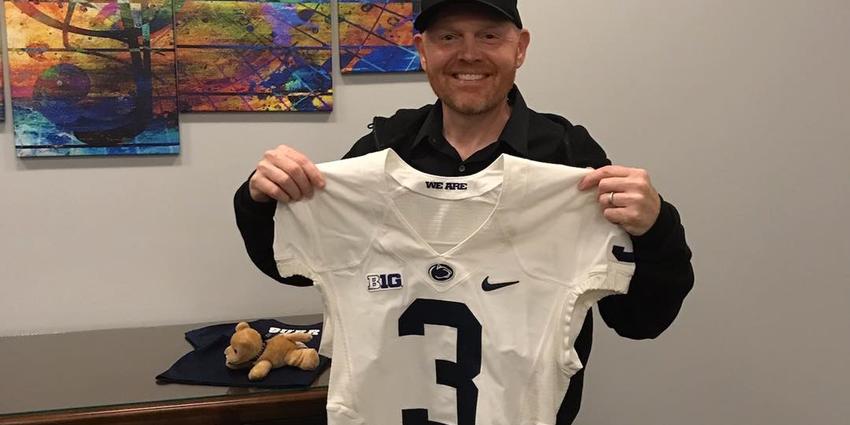 Bill Burr holding a Penn State Football Jersey backstage before his show at the Bryce Jordan Center