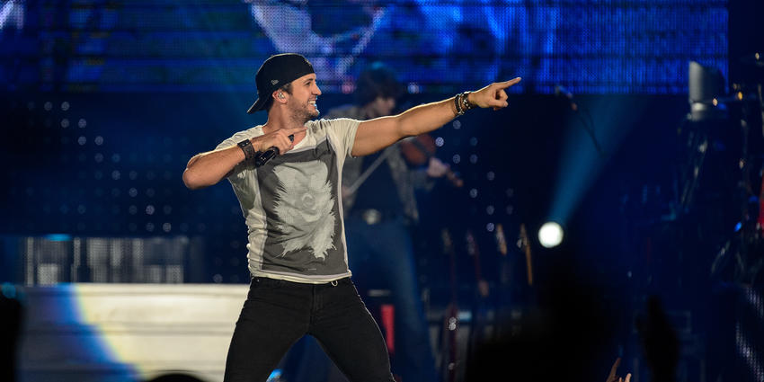 Country singer, Luke Bryan, points to the crowd during his performance at the Bryce Jordan Center in 2013.