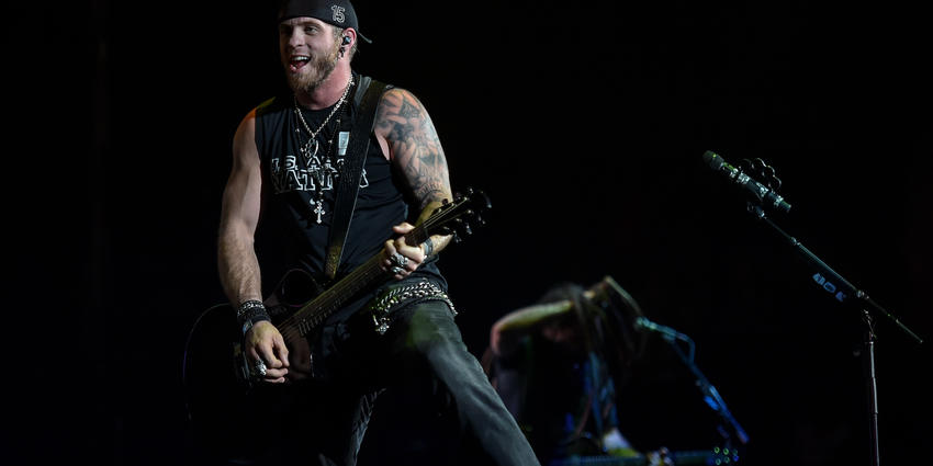 Brantley Gilbert plays his guitar for the audience during his concert at the Bryce Jordan Center in 2014. 