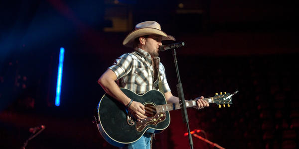 Jason Aldean plays guitar on stage during his concert at the Bryce Jordan Center in 2010.