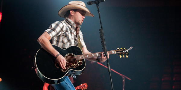 Jason Aldean sings on stage during his "Wide Open" Tour at the Bryce Jordan Center in 2010.