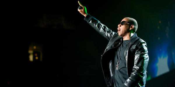Jay-Z holds microphone out to the crowd during his concert at the Bryce Jordan Center in 2009.