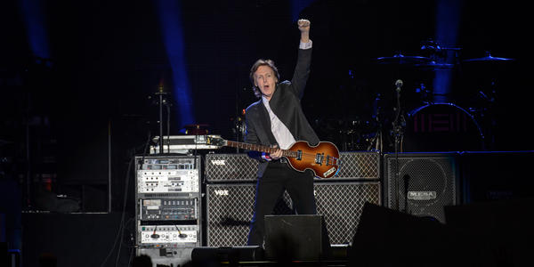 Paul McCartney, plays guitar during his first ever concert at the Bryce Jordan Center in 2015.