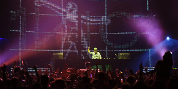 Avicii mixes electric dance tracks on stage at the BJC in 2011.