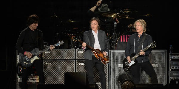 Paul McCartney jams on guitars with his band during the sold out concert at the BJC.