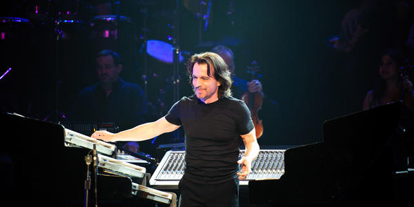 Yanni plays multiple keyboards Tuesday evening while performing at the Bryce Jordan Center