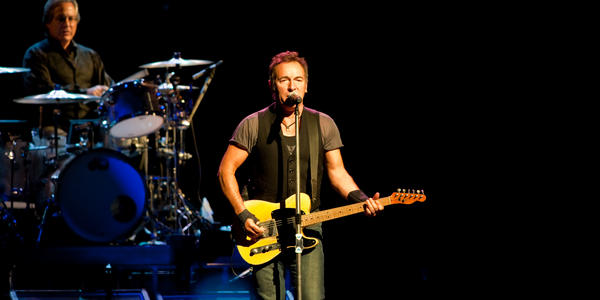 Bruce Springsteen sings and plays guitar during his concert at the Bryce Jordan Center.