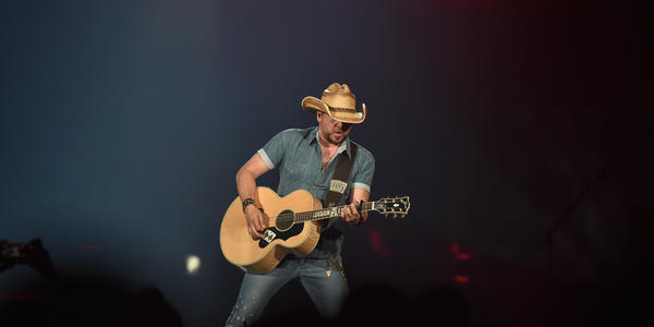 Jason Aldean, playing guitar during his performance at the BJC in 2014.
