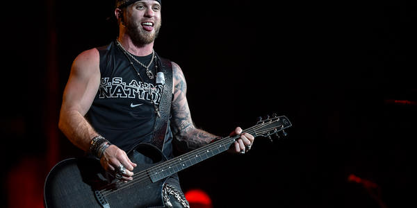 Brantley Gilbert plays his guitar for the audience during his concert at the Bryce Jordan Center in 2014.