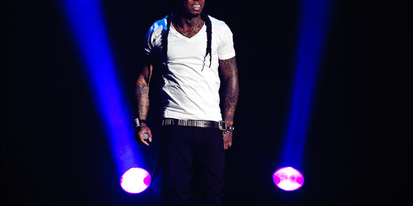 Recording artist Lil Wayne sports a Penn State hat as he smiles at the BJC audience.