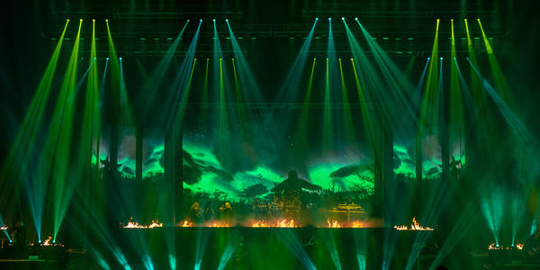 Trans-Siberian Orchestra performs classic Christmas ballads on stage under a mix of laser and strobe lights.