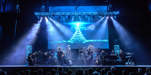Entire Mannheim Steamroller band performs Christmas music on stage at the Bryce Jordan Center in 2013.