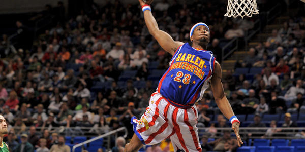 On the way up to a slam dunk for the Harlem Globetrotters. 