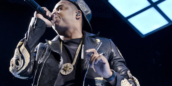 Jay Z, raps into his handheld microphone for the crowd at the BJC in 2014.