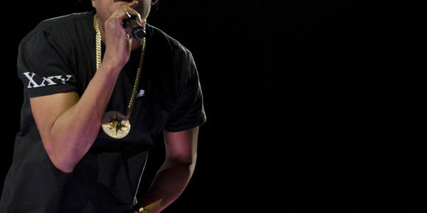 Jay Z, raps into his handheld microphone for the crowd at the BJC in 2014.