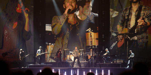 Lady A performs on stage with their band in front of large digitalized real time video of them selves at the BJC in 2012.