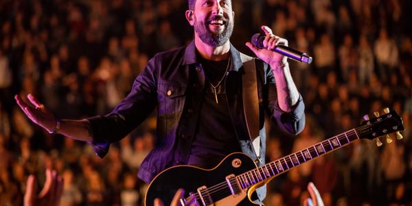 Lead singer of Old Dominion smiles for the crowd at the BJC