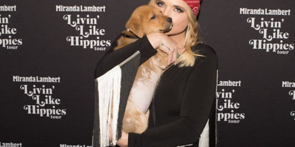Miranda Lambert holding puppy during her visit at BJC